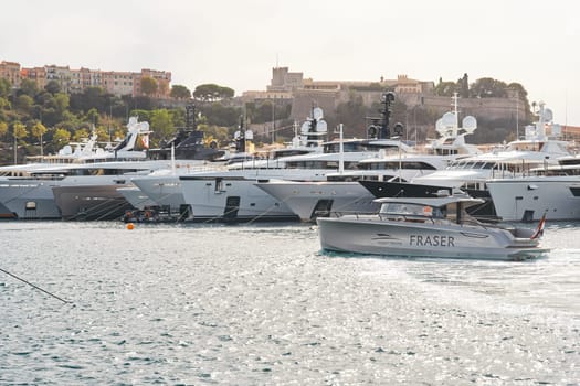 Monaco, Monte Carlo, 29 September 2022 - a lot of luxury yachts at the famous motorboat exhibition, the most expensive boats for the richest people, yacht brokers, boat traffic. High quality photo