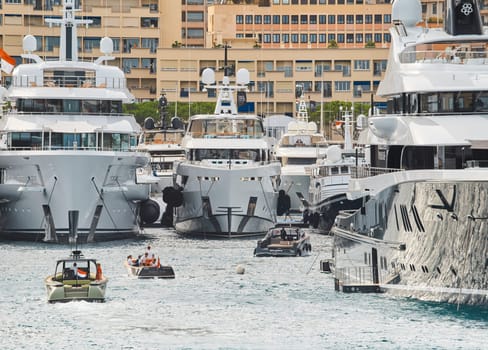 Monaco, Monte Carlo, 29 September 2022 - a lot of luxury yachts at the famous motorboat exhibition, the most expensive boats for the richest people, yacht brokers, boat traffic. High quality photo