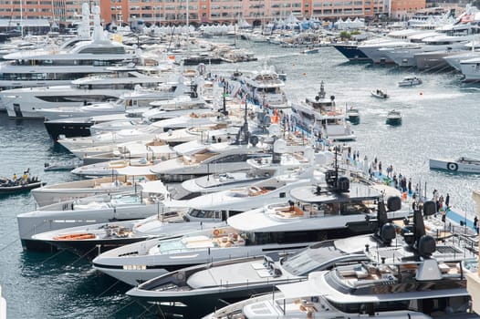 Monaco, Monte Carlo, 29 September 2022 - a lot of luxury yachts at the famous motorboat exhibition, the most expensive boats for the richest people, yacht brokers, boat traffic. High quality photo