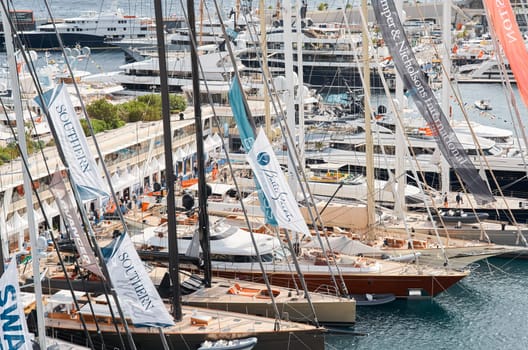 Monaco, Monte Carlo, 29 September 2022 - a lot of luxury yachts at the famous motorboat exhibition, the most expensive boats for the richest people, yacht brokers, boat traffic. High quality photo