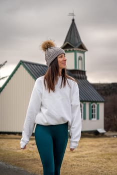 Woman with woolen hat in a church in Thingvellir, Iceland