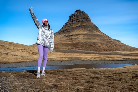 Woman with metallic jacket in Kirkjufell, Iceland