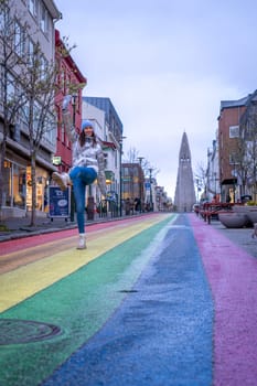 Woman with metallic jacket on Rainbow street in Reykjavik