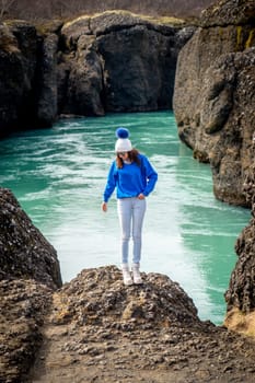 Woman posing in Bruarhlod canyon in Iceland