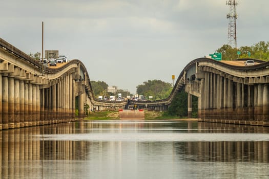 Baton Rouge, LA - 27 October 2023: Receding pillars of the I-10 interstate bridges over the bayou of Atchafalaya basin