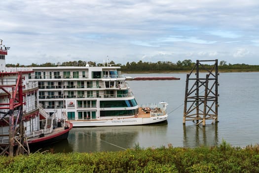 Baton Rouge, LA - 27 October 2023: Viking Mississippi river cruise boat docked alongside the riverboat casino in Baton Rouge Louisiana