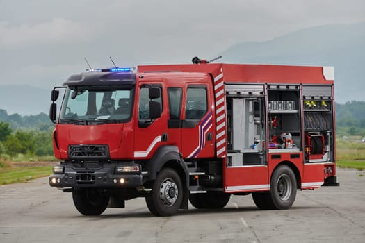 In this captivating scene, a state-of-the-art firetruck, equipped with advanced rescue technology, stands ready with its skilled firefighting team, prepared to intervene and respond rapidly to emergencies, ensuring the safety and protection of the community.