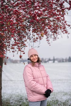 Winter Elegance: Portrait of a Beautiful Girl in a Snowy European Village