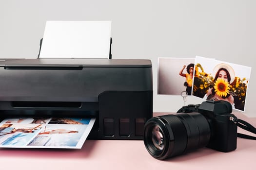 Printer and photo camera on the table. Printing photos concept