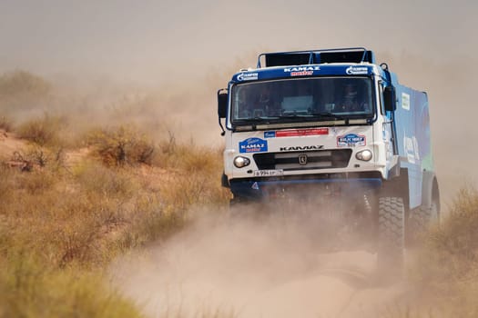 Extreme off-road racing. NEW Sports truck KAMAZ gets over the difficult part of the route during the Rally raid in sand. 14.07.2022 Kalmykia, Russia.