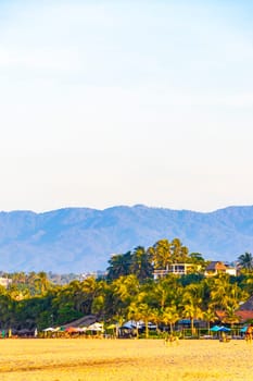 Puerto Escondido Oaxaca Mexico 16. November 2022 Beautiful tropical and natural city and seascape landscape panorama view with pacific ocean sea palms palm trees and beach with waves of Zicatela.