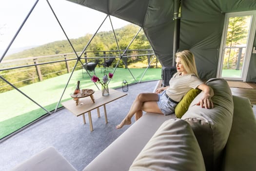 female tourist in transparent hotel dome.