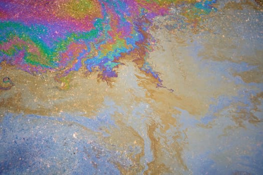 Oil stain, Gas Stain drop from the Car on the Parking Lot Floor. Environmental pollution concept