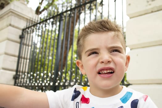 Portrait of four year old boy gesturing. One person