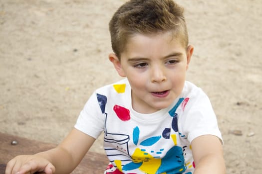 Portrait of four year old boy gesturing. One person