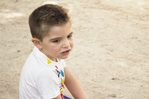 Portrait of four year old boy gesturing. One person