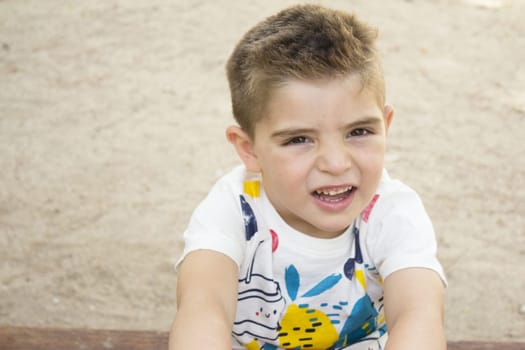 Portrait of four year old boy gesturing. One person