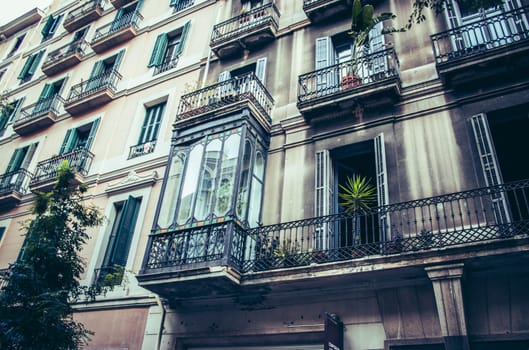 Facade of old apartment building with balcony, Barcelona, Catalonia. Spain photo. Beautiful urban scenery photography. Street scene. High quality picture for wallpaper, article
