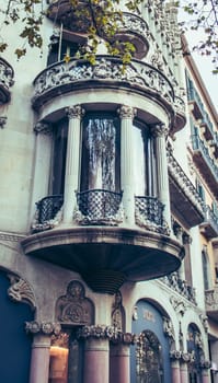 Historical apartment building with balcony, Catalonia. Street at sunset time in beautiful Barcelona. High quality picture for wallpaper, article