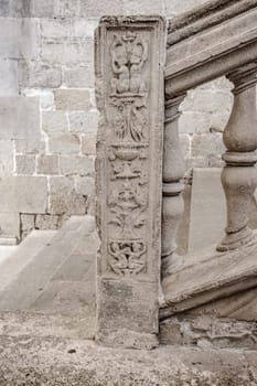 Classic old balustrade with carved stone elements. Beautiful urban scenery photography with attic or staircase railing. Street scene. High quality picture for wallpaper, article