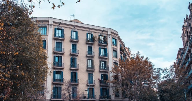 Historical building on Rambla street cityscape image. Winter parkland in Barcelona, Spain photo. Beautiful urban scenery photography. Street scene. High quality picture for wallpaper, article