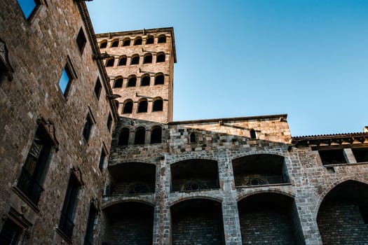 Historical architecture in Barcelona cityscape photo. Beautiful urban scenery photography. Torre Mirador and Palau del Lloctinent. Placa del Rei in Barcelona, Catalonia, Spain. High quality picture for wallpaper, article