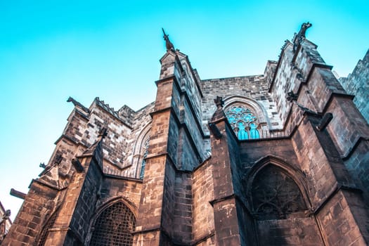 Photo of cathedral in the old Gothic Quarter, Barcelona, Catalonia. Beautiful urban scene photography. Side view of medieval wall in Catalonia, Spain. High quality picture for wallpaper, article