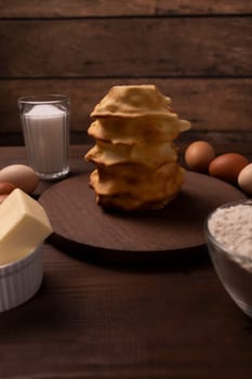 Set Of Ingredients For Baking Baumkuchen, Sakotis, Handmade sekacz On Wooden Table, Traditional Spit Cake Of Lithuanian, Polish, German,belarusian Cuisine Made Of Butter,eggs, Flour,sugar. Vertical