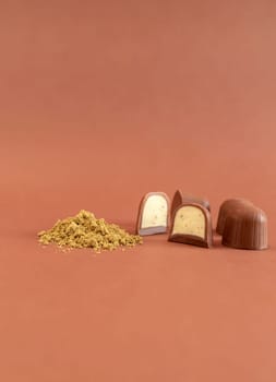 Mockup Brown Cannabis Chocolate Sweets And Green Hemp Protein Powder On Brown Background. Vertical Plane. Copy Space For Text. Healthy Snack. High quality photo