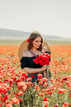 Woman poppies field. portrait of a happy woman with long hair in a poppy field and enjoying the beauty of nature in a warm summer day