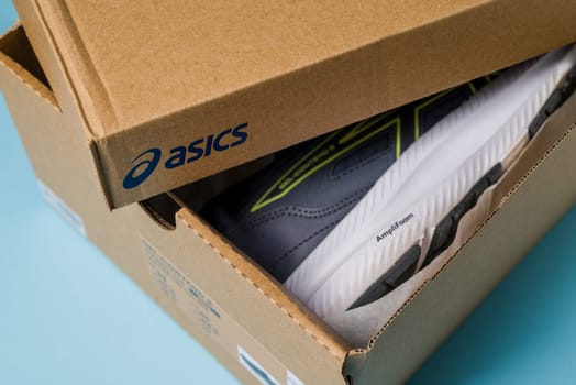 Antalya, Turkey - November 28, 2023: Asics running shoes with new technology soles in shoe box