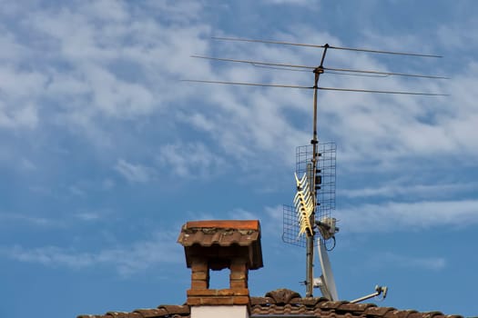 Television antenna on a brick roof