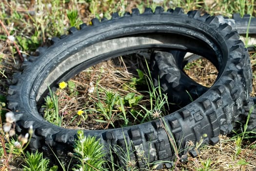Close up detail of an old abandoned motorbike tire