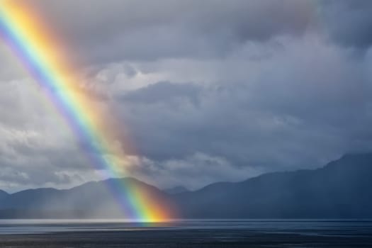 A rainbow going down on the Alaskan Sea