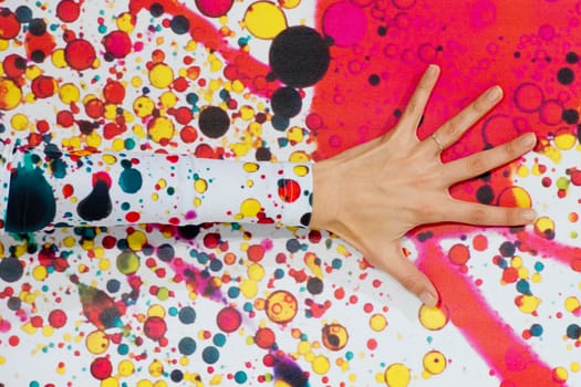 female hand detail on multi colour bubble wall