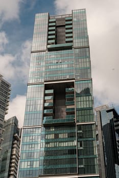 Green Building Amid Reflective Cityscape