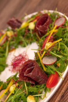 Tasty salad ham with fresh vegetables on wooden background, High quality photo