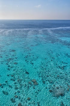 reef aerial view with turquoise clear water