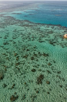 reef aerial view with turquoise clear water