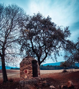 View of stone barn and in open field on morning. Farming house in the countryside of a small village in Catalonia. Typical country house or farmhouse in Spain. High quality picture for wallpaper, article