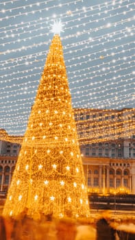 People in front of Christmas tree at Bucharest Christmas Market