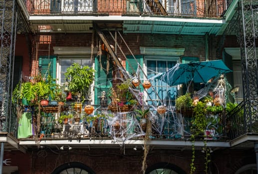 New Orleans, LA - 28 October 2023: Halloween decorations on tradional building in the French Quarter with wrought iron balconies