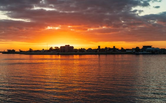 Sun rising over the Mississippi River from the French Quarter of New Orleans