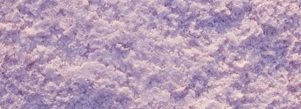 Natural Pink salt Close up. Surface of a salt lake. Natural background. Natural formations of Salt crystals. Top view on Pink salt lake.