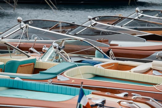 Few luxury retro motor boats in row at the famous motorboat exhibition in the principality of Monaco, Monte Carlo, the most expensive boats for the richest people, boats for rich clients