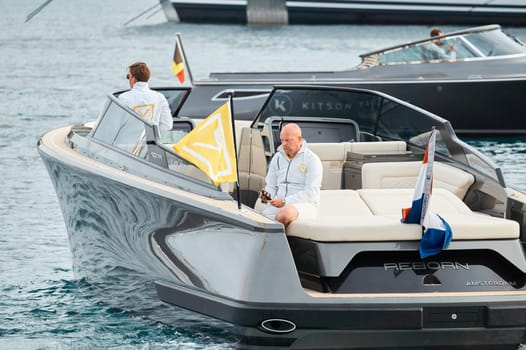 Monaco, Monte Carlo, 29 September 2022 - Water taxi by luxury motorboat on the famous yacht exhibition, a lot of most expensive luxury yachts, richest people, yacht brokers, boat traffic. High quality photo