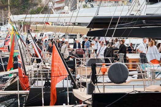 Monaco, Monte Carlo, 29 September 2022 - The famous motorboat exhibition, mega yacht show, clients and yacht brokers discuss the novelties of the boating industry, look at the mega yachts presented. High quality photo