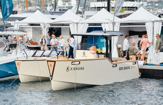 Monaco, Monte Carlo, 29 September 2022 - The famous motorboat exhibition, mega yacht show, clients and yacht brokers discuss the novelties of the boating industry, look at the mega yachts presented. High quality photo