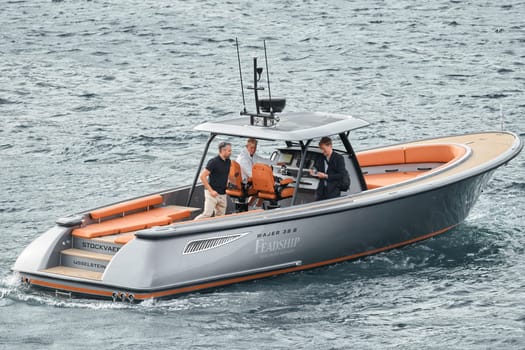 Monaco, Monte Carlo, 29 September 2022 - Water taxi by luxury motorboat on the famous yacht exhibition, a lot of most expensive luxury yachts, richest people, yacht brokers, boat traffic. High quality photo