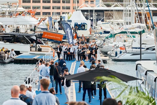 Monaco, Monte Carlo, 29 September 2022 - The famous motorboat exhibition, mega yacht show, clients and yacht brokers discuss the novelties of the boating industry, look at the mega yachts presented. High quality photo